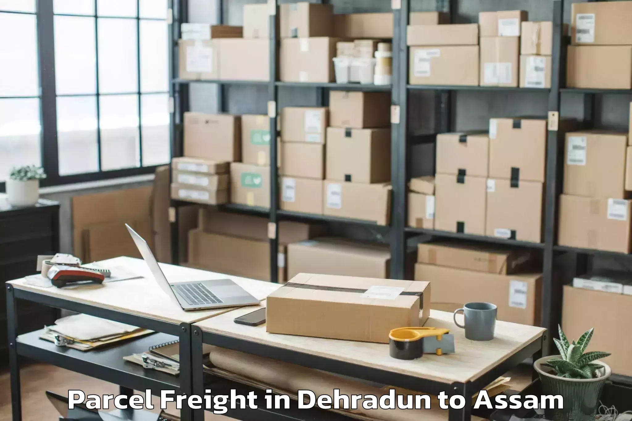 Book Your Dehradun to Chaparmukh Parcel Freight Today